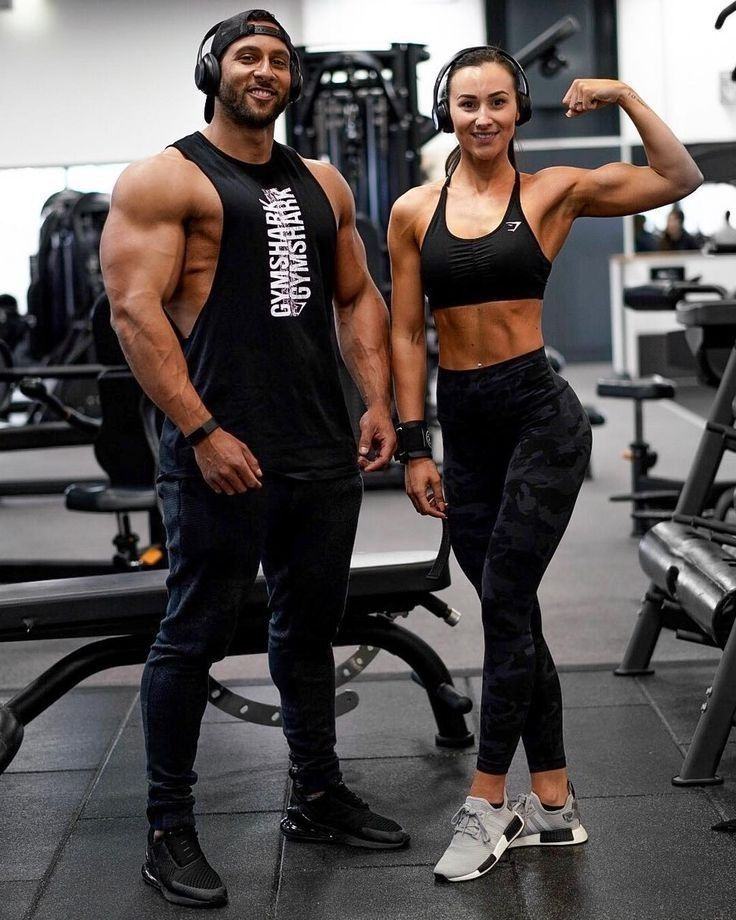 Two active adults at a gym